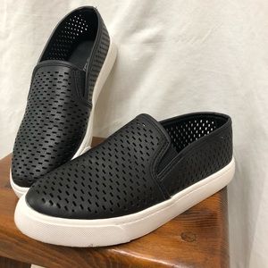 Black slip on shoes.